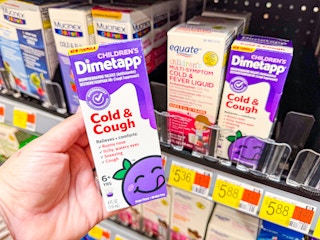 hand holding childrens dimetapp at walmart