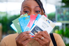 a woman holding gift cards