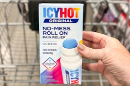 hand holding icy hot roll on