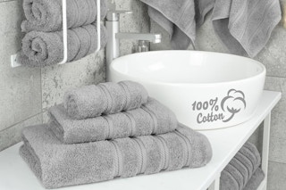 a grey towel set in a bathroom
