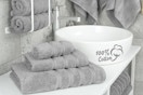 a grey towel set in a bathroom