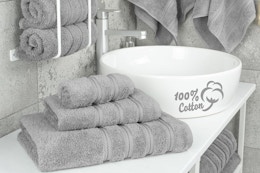 a grey towel set in a bathroom