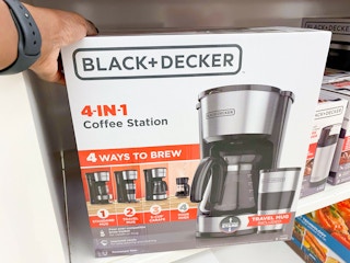 hand touching coffee maker box