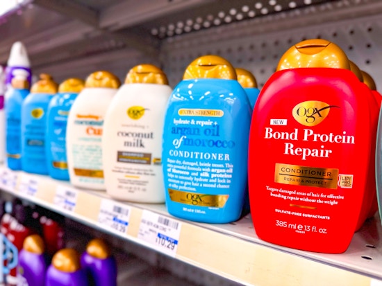 cvs shelf with ogx hair care bottles