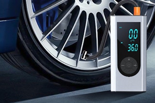 a tire inflator next to a car