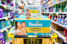 pampers swaddlers diapers and baby wipes stacked in yellow shopping cart