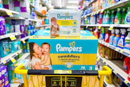pampers swaddlers diapers and baby wipes stacked in yellow shopping cart