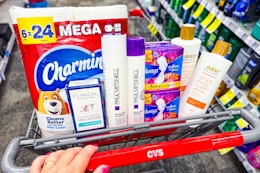 charmin toilet paper, secret deodorant, paul mitchell shampoo, always pads, and raw sugar body wash in a cart