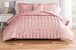 Lifestyle image of the Mainstays Blush Pink 10 Piece Bed in a Bag Comforter Set in bedroom setting