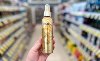 hand holding pantene hair care