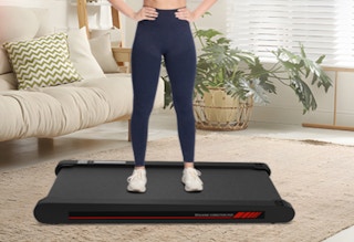 a person on a treadmill in a living room