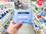 hand holding neutrogena makeup wipes in walgreens