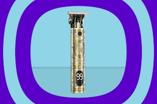 a gold hair trimmer on a blue background