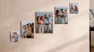 family photos on canvas on a wall