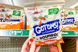 hand holding a bag of dollar tree gerber get'ems