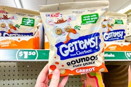 hand holding a bag of dollar tree gerber get'ems