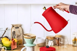 Lifestyle image of the Beautiful Electric Kettle in the color red