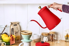Lifestyle image of the Beautiful Electric Kettle in the color red