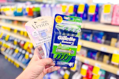 person holding gillette and venus razors