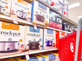 target cart parked by crock-pot slow cookers sitting on a shelf