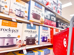 target cart parked by crock-pot slow cookers sitting on a shelf