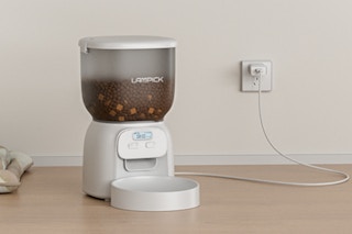 automatic cat feeder plugged into a wall