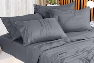 dark grey sheets and pillowcases on a bed