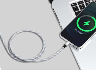 a nylon charging cord connected to an iPhone