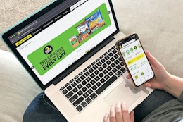 a person looking at the Dollar General app on their phone and the Dollar General website on their laptop