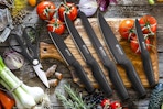 black knife set on wood chopping block