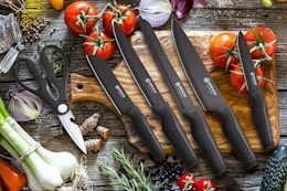 black knife set on wood chopping block
