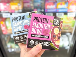 2 Pitaya Foods Smoothie Bowls held up in freezer aisle in Walmart store