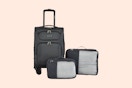 a luggage set on a cream background
