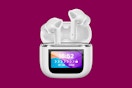 wireless earbuds on a magenta background
