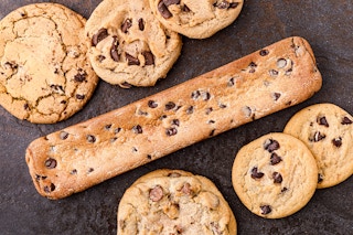 a subway footlong cookie next to some normal cookies