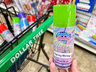 Goofy String held in front of a Dollar Tree shopping cart
