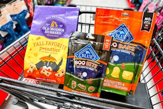 3 bags of halloween dog treats in a cart