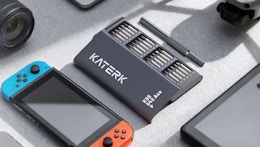 a screwdriver set next to a Nintendo Switch 