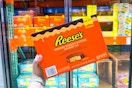 hand holding reese's desserts cups at costco