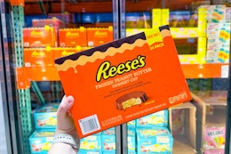 hand holding reese's desserts cups at costco