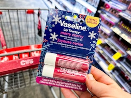person holding a 2-pack of vaseline lip therapy balm