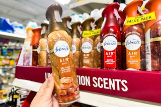 hand holding a can of febreze air mist