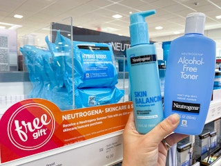 someone holding three neutrogena skin products