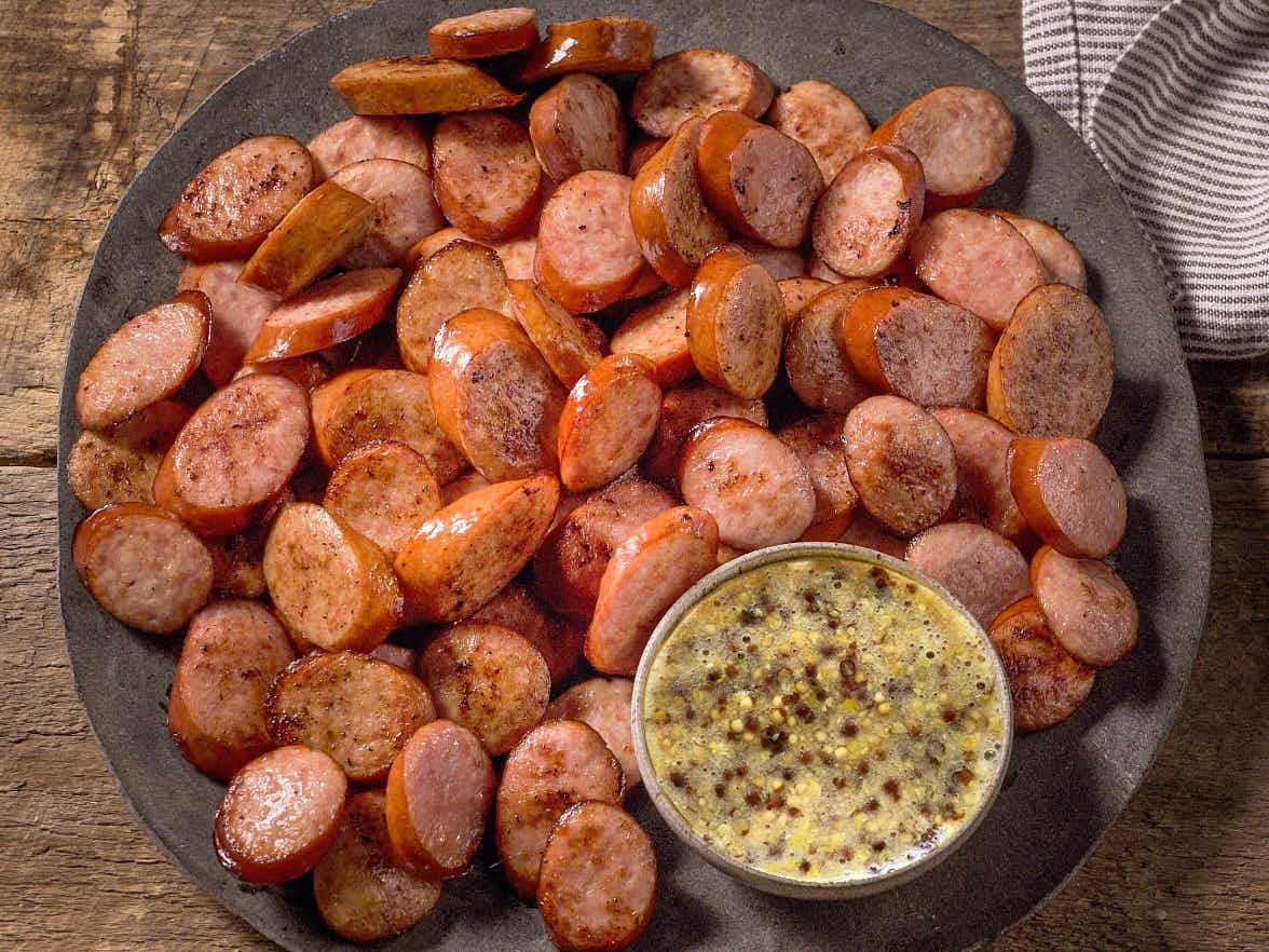 sliced sausage with stone ground mustard dipping sauce