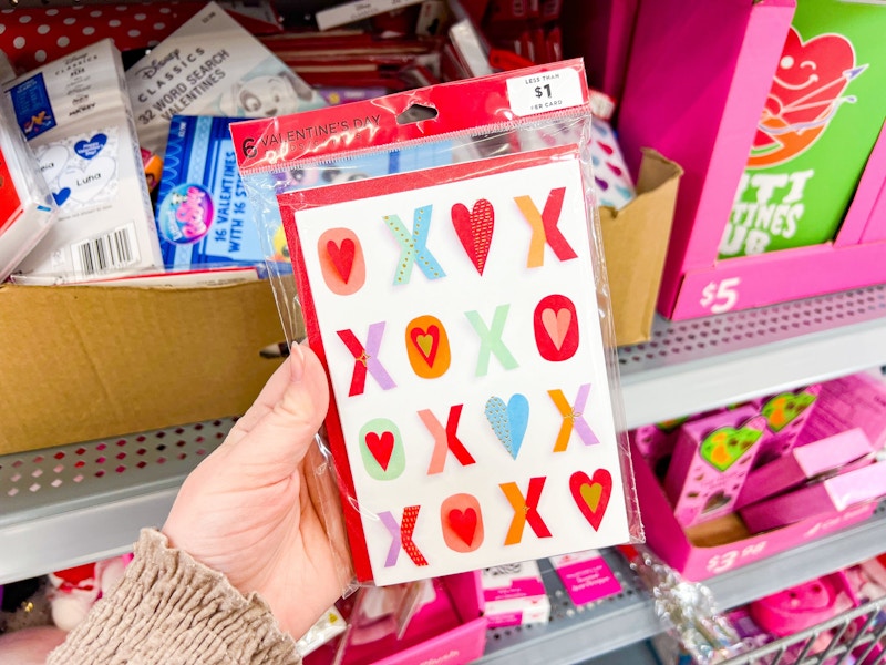 hand holding valentines day cards at walmart