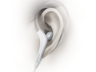 Sony sport headphones in a person's ear.