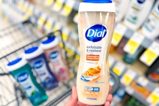hand holding a bottle of dial body wash