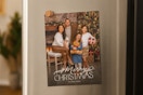 a christmas card on a fridge