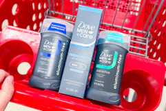hand pushing a shopping cart with Dove Men+Care deodorants
