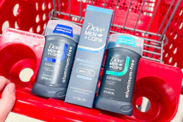hand pushing a shopping cart with Dove Men+Care deodorants